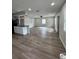Spacious living area with new wood floors, modern lighting and a breakfast bar at 602 Taylor Blvd, Winter Haven, FL 33880