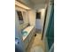 Bathroom with light blue vanity and shower/tub combo at 619 Cassandra Ln, Lakeland, FL 33809