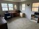 Bedroom with desk, dresser, and ample natural light at 619 Cassandra Ln, Lakeland, FL 33809