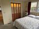 Bright bedroom with double bed, window, and closet at 619 Cassandra Ln, Lakeland, FL 33809
