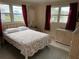 Bedroom with double bed and wicker dresser at 619 Cassandra Ln, Lakeland, FL 33809