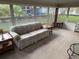 Sunroom with floral sofa and view of backyard at 619 Cassandra Ln, Lakeland, FL 33809