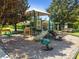 playground with a shaded structure and play equipment at 252 Tavestock Loop, Winter Springs, FL 32708
