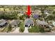 Aerial view of a house featuring a gray roof and a well-maintained backyard, with surrounding houses at 1918 Dr Martin L King Jr Way, Haines City, FL 33844