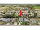 Aerial view of a house featuring a gray roof and a well-maintained backyard, with surrounding houses at 1918 Dr Martin L King Jr Way, Haines City, FL 33844