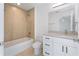 Bathroom featuring a shower-tub combo, granite vanity, and modern finishes at 1918 Dr Martin L King Jr Way, Haines City, FL 33844