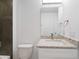 Bathroom featuring granite top vanity, white cabinets and modern fixtures at 1918 Dr Martin L King Jr Way, Haines City, FL 33844