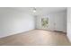 Bright bedroom with modern flooring, ceiling fan, and natural light at 1918 Dr Martin L King Jr Way, Haines City, FL 33844