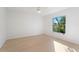 Bright bedroom with large window showing great natural light and light wood flooring at 1918 Dr Martin L King Jr Way, Haines City, FL 33844