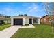 Charming single story home with black garage door and modern exterior paint at 1918 Dr Martin L King Jr Way, Haines City, FL 33844