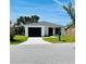 Charming single story home with a black garage door and well maintained lawn at 1918 Dr Martin L King Jr Way, Haines City, FL 33844