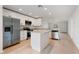 Modern kitchen with white cabinets, stainless steel appliances, and a center island at 1918 Dr Martin L King Jr Way, Haines City, FL 33844