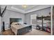 Comfortable bedroom with a decorative ceiling, a queen bed, carpet and many interesting decorative elements at 6857 Eagle Ridge Loop, Lakeland, FL 33813
