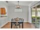 Dining room with chandelier and view of outdoor patio at 6857 Eagle Ridge Loop, Lakeland, FL 33813