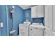 Well-lit laundry room with a modern washer, dryer, and convenient storage cabinets at 6857 Eagle Ridge Loop, Lakeland, FL 33813