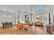 Spacious living room featuring high ceilings, hardwood floors, and abundant natural light at 6857 Eagle Ridge Loop, Lakeland, FL 33813