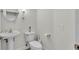 Simple and clean half-bathroom with pedestal sink and toilet at 6857 Eagle Ridge Loop, Lakeland, FL 33813