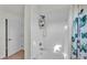 This bathroom features a shower with white tiles, and an interesting curtain with butterflies on it at 6857 Eagle Ridge Loop, Lakeland, FL 33813