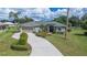 Single-story home with attached garage and landscaped yard at 1562 Auburn Oaks Ct, Auburndale, FL 33823