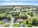 Expansive aerial view of home showcasing lush landscaping and neighborhood at 1001 Lena Run Ct, Winter Haven, FL 33880