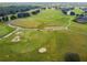 Expansive golf course view, showcasing the well-maintained green, sand bunkers, and winding cart paths at 1045 View Pointe Way, Lakeland, FL 33813