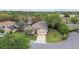 Aerial view of a single Gathering home with a manicured lawn and mature trees at 1045 View Pointe Way, Lakeland, FL 33813