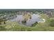 Enjoy a stunning aerial view of the community's picturesque lake and lush golf course at 1045 View Pointe Way, Lakeland, FL 33813