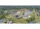Enjoy a stunning aerial view of the community's picturesque lake and lush golf course at 1045 View Pointe Way, Lakeland, FL 33813
