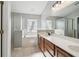 Well-lit bathroom with a double sink vanity, soaking tub, a separate shower, and tile flooring at 1045 View Pointe Way, Lakeland, FL 33813