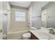 A bright bathroom featuring a bathtub, toilet and sink at 1045 View Pointe Way, Lakeland, FL 33813