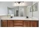 Bright bathroom featuring a double sink vanity and a large mirror at 1045 View Pointe Way, Lakeland, FL 33813