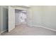 Bedroom featuring neutral walls, carpet flooring, and an arched doorway at 1045 View Pointe Way, Lakeland, FL 33813