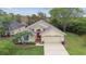 Charming single-story home with a well-manicured lawn and a two-car garage at 1045 View Pointe Way, Lakeland, FL 33813
