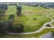 Aerial view of the lush golf course with manicured greens and scenic fairways at 1045 View Pointe Way, Lakeland, FL 33813