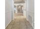 Interior hallway view showcases tile flooring, white walls, arched doorways, and an open layout at 1045 View Pointe Way, Lakeland, FL 33813