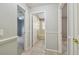 Hallway view with access to a bathroom, bedroom and another room at 1045 View Pointe Way, Lakeland, FL 33813