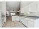 Bright kitchen features white cabinetry, tile flooring, and a functional layout perfect for cooking and entertaining at 1045 View Pointe Way, Lakeland, FL 33813