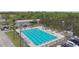Aerial view of an Olympic sized pool, lounge chairs and shade umbrellas for relaxation at 1045 View Pointe Way, Lakeland, FL 33813