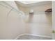 Walk-in closet showing wire shelving, neutral walls, and carpeted floor at 1045 View Pointe Way, Lakeland, FL 33813