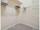 Bright walk-in closet featuring wire shelving, neutral walls, and carpeted floor at 1045 View Pointe Way, Lakeland, FL 33813