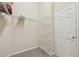 Walk-in closet with wire shelving, neutral walls, and a carpeted floor at 1045 View Pointe Way, Lakeland, FL 33813