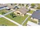 Aerial shot showcases the fenced backyard and the covered patio at 834 Auburn Preserve Blvd, Auburndale, FL 33823