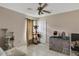 This is an empty bedroom with tile flooring and a ceiling fan at 834 Auburn Preserve Blvd, Auburndale, FL 33823
