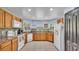 Bright kitchen featuring tile floors, modern appliances, and plenty of counter space at 834 Auburn Preserve Blvd, Auburndale, FL 33823
