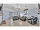 Spacious living room featuring tile floors, ceiling fan and sliding glass door to the back yard at 834 Auburn Preserve Blvd, Auburndale, FL 33823