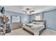 Main bedroom featuring a ceiling fan, dresser, and tile floors at 834 Auburn Preserve Blvd, Auburndale, FL 33823