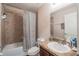 Cozy bathroom with a shower-tub combo with a striped curtain and a single sink vanity at 1619 Prairie Blossom Dr, Lakeland, FL 33810