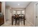 Bright dining area featuring a bay window providing lots of natural light and an adjacent door to the kitchen at 1619 Prairie Blossom Dr, Lakeland, FL 33810