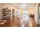 Open living room with hardwood floors, neutral colors, and sliding glass doors to a covered patio at 1619 Prairie Blossom Dr, Lakeland, FL 33810