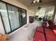Enclosed patio showcasing comfortable seating and sliding glass doors leading indoors at 1619 Prairie Blossom Dr, Lakeland, FL 33810